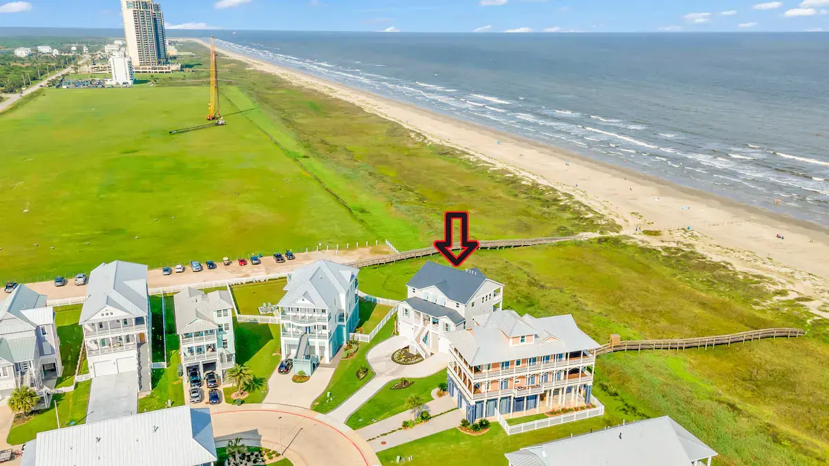 Aerial view showing the home beside the dune boardwalk to the beach at Fishwife