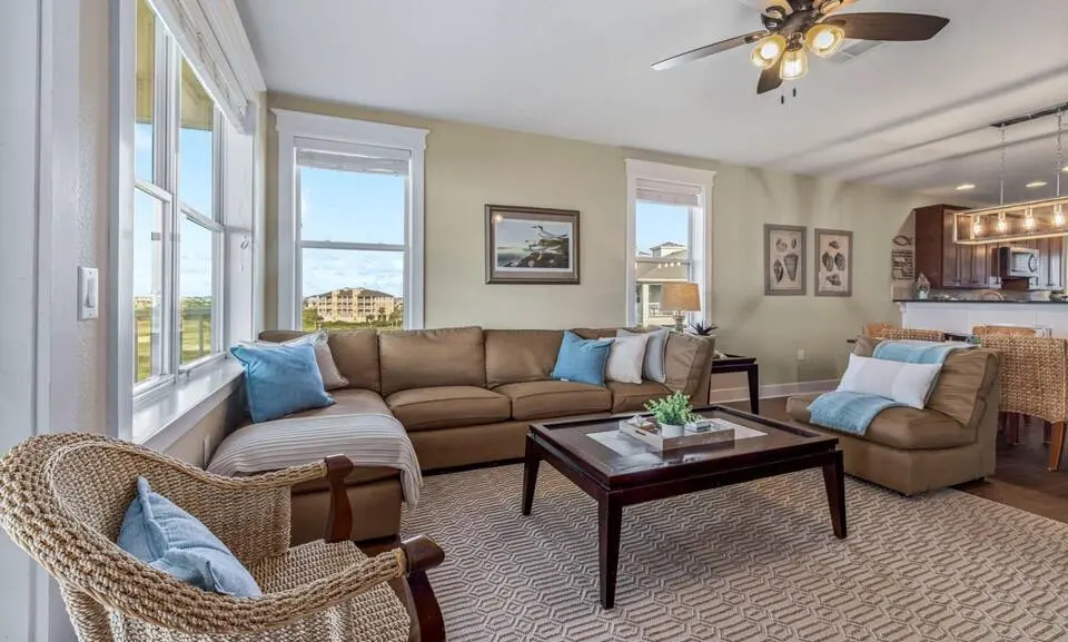 Top-Floor Condo at Pointe West vacation rental in Galveston - open living room with sectional and water views